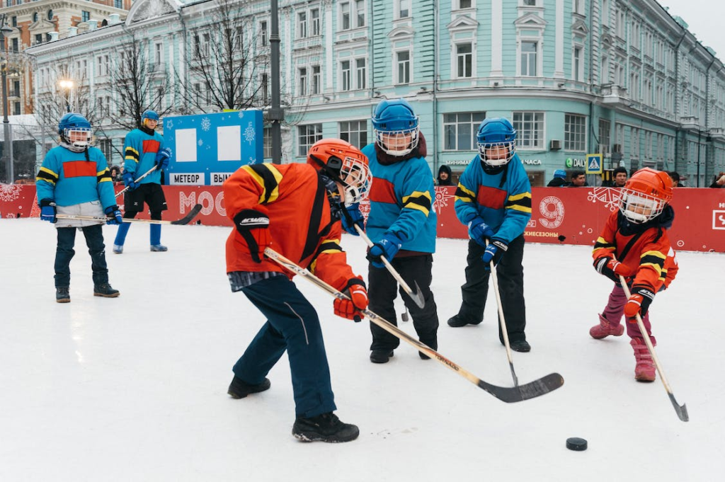 group of kids playing ice hockey